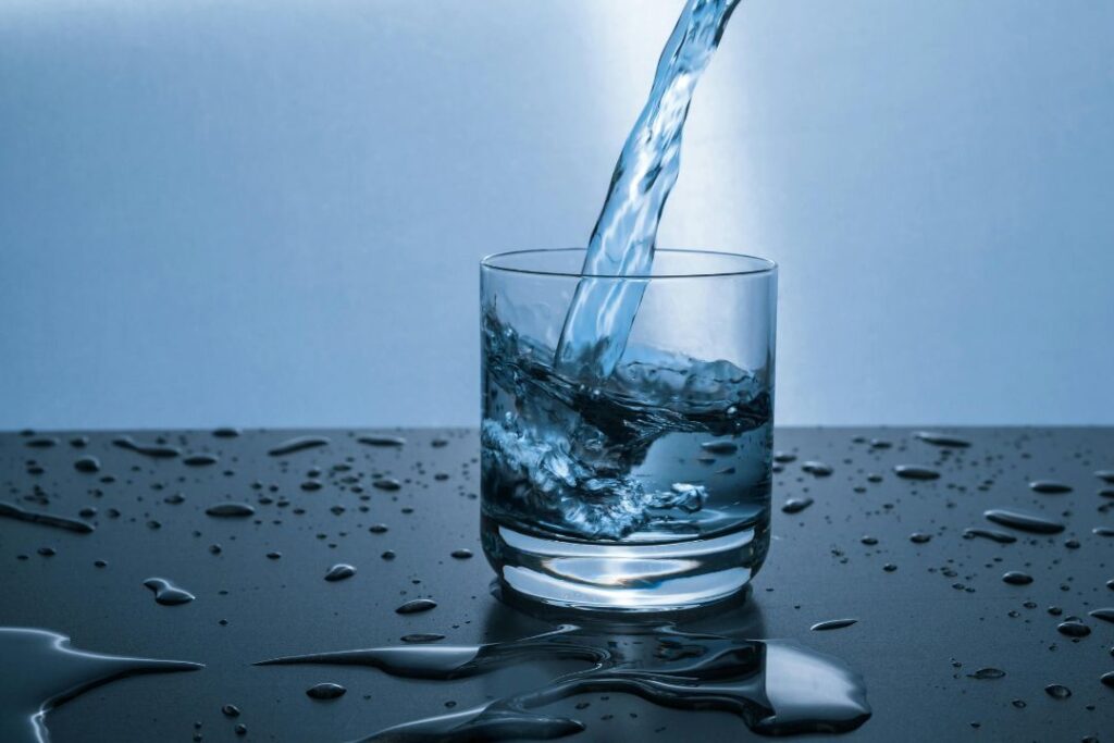 a glass of water being filled