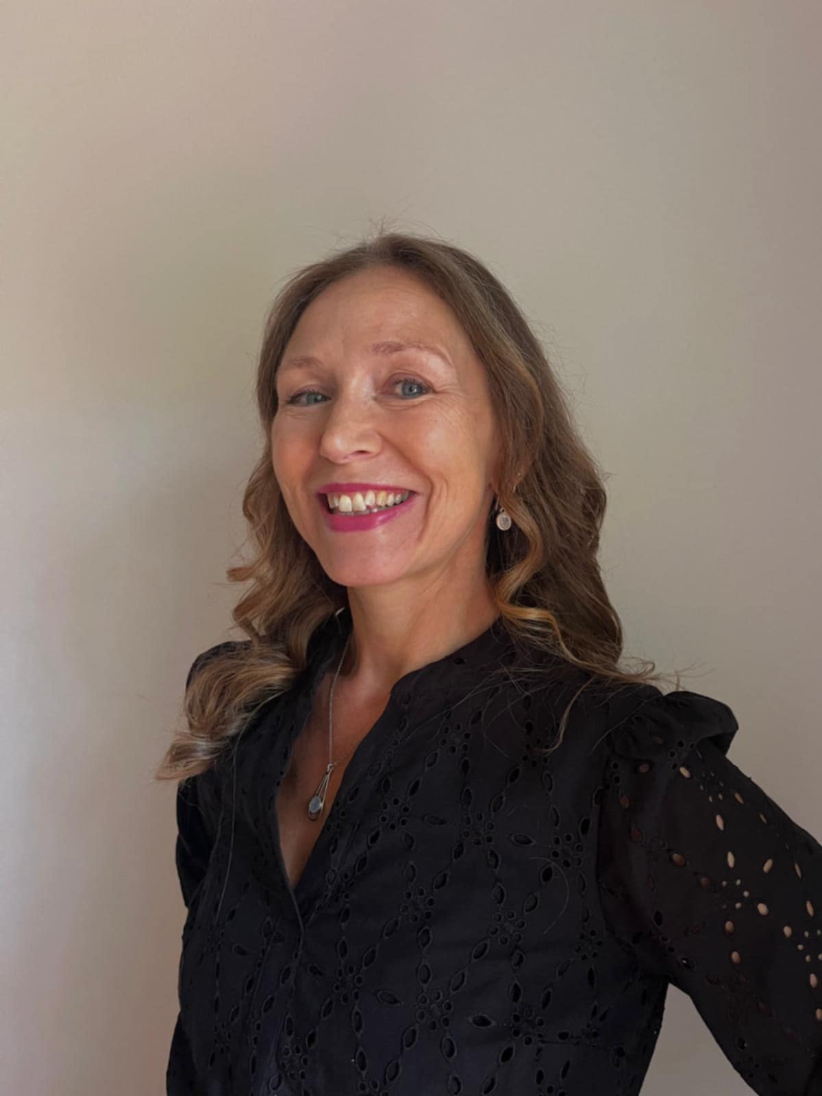 a profile photo of Carolyn Hall, content writer and strategist for travel and wellness brands