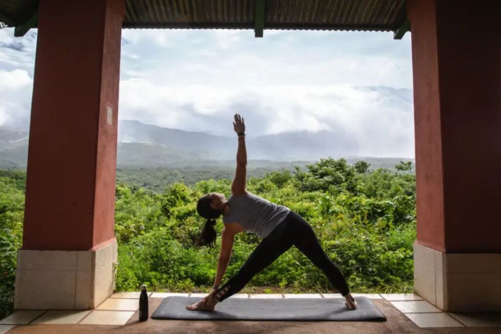 a woman doing yoga in the Blue Zones