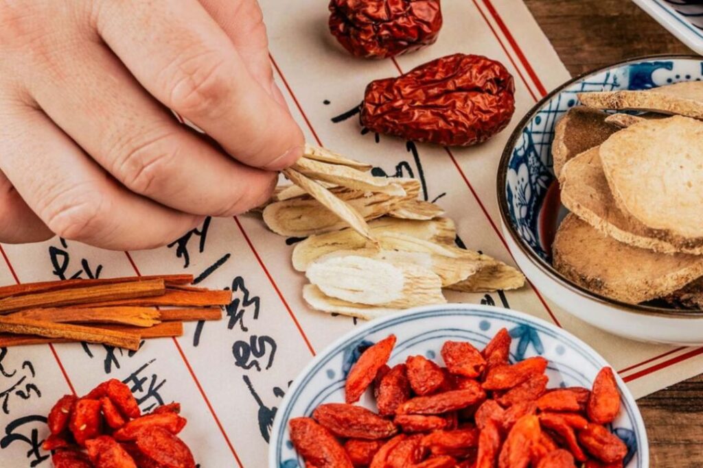 a selection of chinese herbs laid out on a table